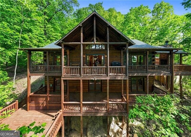 512 Picklesimer Mtn Rd, Morganton, GA 30560 - rear view of property featuring a deck, metal roof, and log siding