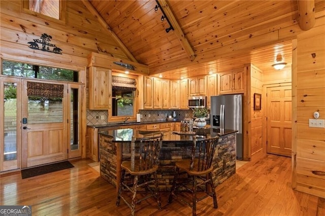 512 Picklesimer Mtn Rd, Morganton, GA 30560 - kitchen featuring appliances with stainless steel finishes, dark countertops, wood ceiling, light wood finished floors, and decorative backsplash