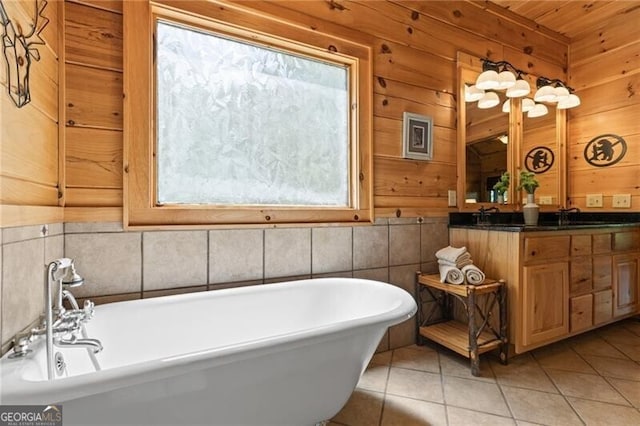 512 Picklesimer Mtn Rd, Morganton, GA 30560 - full bathroom featuring tile patterned floors, wooden walls, a freestanding tub, and double vanity