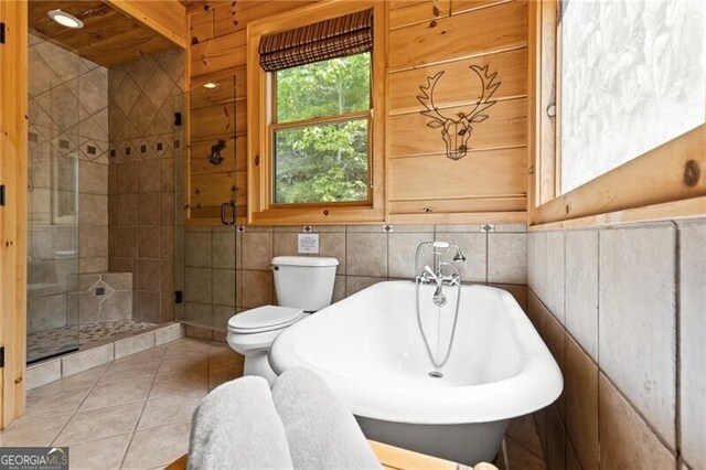 512 Picklesimer Mtn Rd, Morganton, GA 30560 - full bathroom featuring a freestanding tub, a stall shower, toilet, and tile patterned flooring