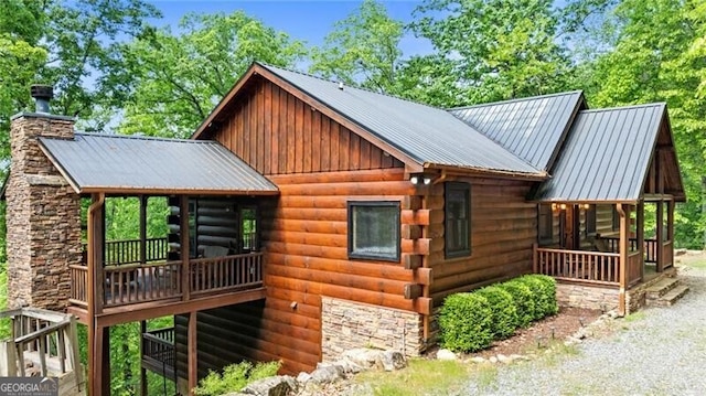 512 Picklesimer Mtn Rd, Morganton, GA 30560 - view of side of property with a chimney, metal roof, and a deck
