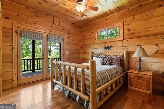 512 Picklesimer Mtn Rd, Morganton, GA 30560 - bedroom featuring multiple windows, access to exterior, hardwood / wood-style floors, wooden walls, and wooden ceiling