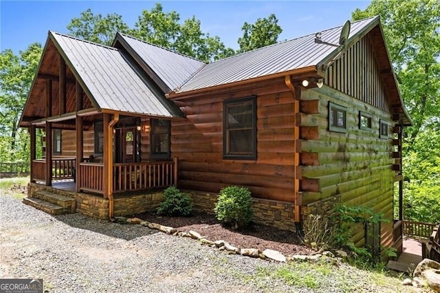 512 Picklesimer Mtn Rd, Morganton, GA 30560 - view of property exterior with covered porch, metal roof, log exterior, and a standing seam roof