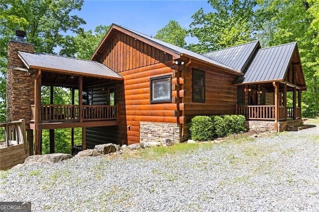 512 Picklesimer Mtn Rd, Morganton, GA 30560 - view of side of property featuring a chimney, metal roof, covered porch, and board and batten siding