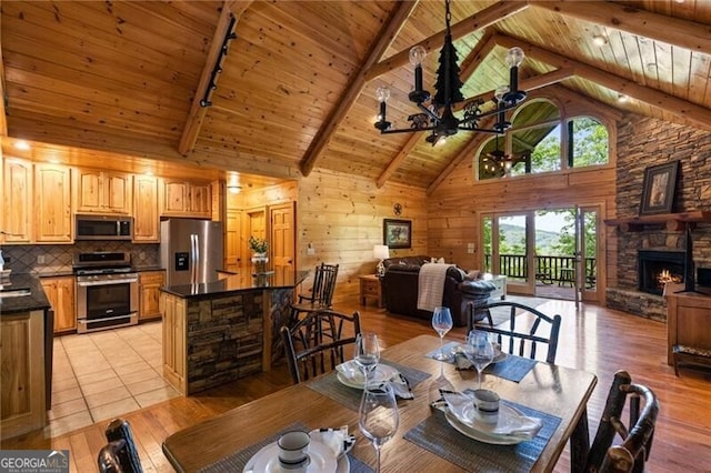 512 Picklesimer Mtn Rd, Morganton, GA 30560 - dining space featuring wooden ceiling, rail lighting, beam ceiling, light wood-style floors, and a ceiling fan