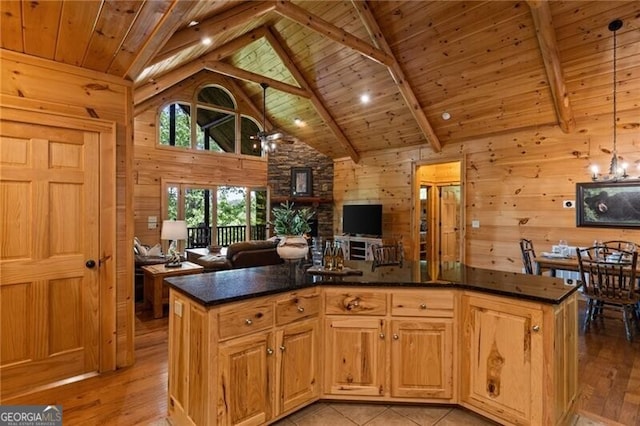 512 Picklesimer Mtn Rd, Morganton, GA 30560 - kitchen featuring wood walls, open floor plan, wooden ceiling, beamed ceiling, and a kitchen island
