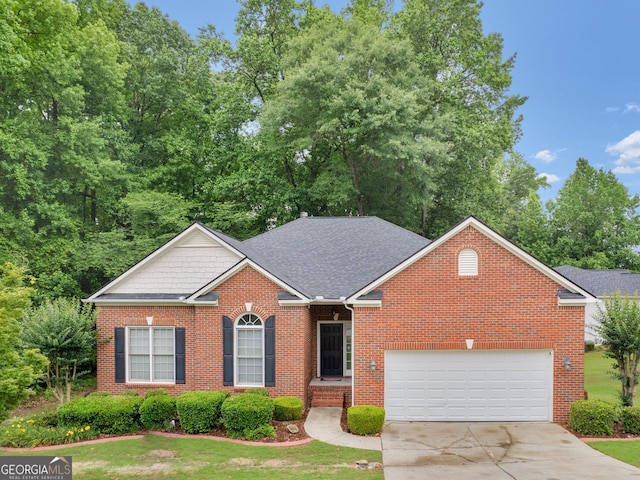 361 Brackin Trce, Grayson, GA 30017 - view of front of house featuring brick siding, concrete driveway, a shingled roof, and a front lawn