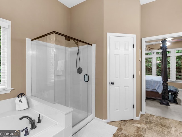 361 Brackin Trce, Grayson, GA 30017 - bathroom with a stall shower, a bath, ensuite bathroom, and baseboards