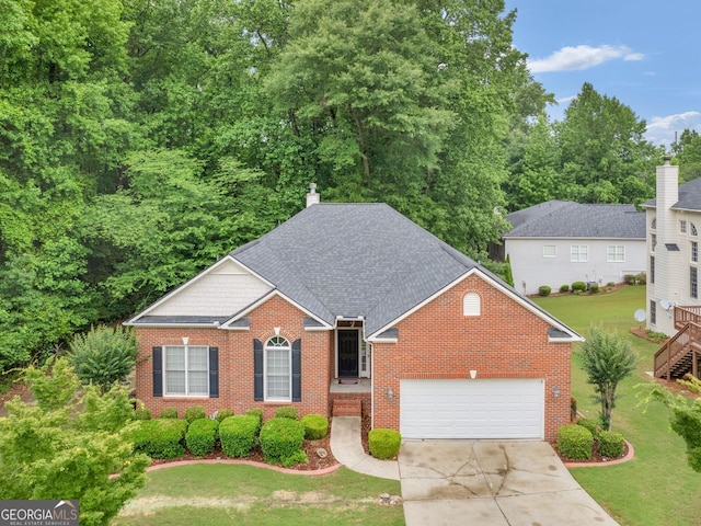 361 Brackin Trce, Grayson, GA 30017 - view of front facade featuring brick siding, concrete driveway, an attached garage, and a front lawn