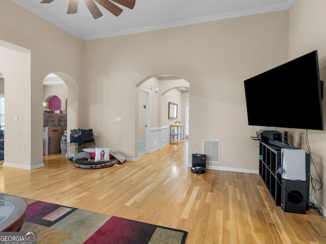 361 Brackin Trce, Grayson, GA 30017 - living area featuring a ceiling fan, light wood-type flooring, arched walkways, ornamental molding, and baseboards