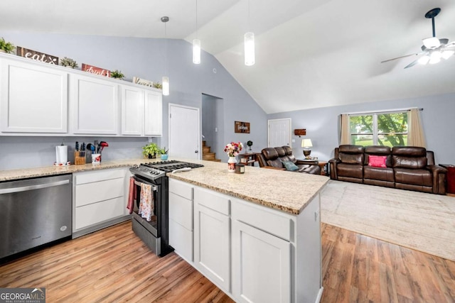115 S Meadowcliff Cir, Carrollton, GA 30116 - kitchen featuring dishwasher, range with gas stovetop, lofted ceiling, a ceiling fan, and white cabinetry