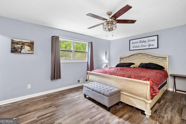 115 S Meadowcliff Cir, Carrollton, GA 30116 - bedroom with wood finished floors and a ceiling fan