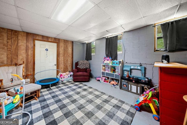 115 S Meadowcliff Cir, Carrollton, GA 30116 - playroom with a drop ceiling, wooden walls, carpet floors, and concrete block wall