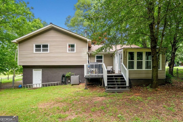 115 S Meadowcliff Cir, Carrollton, GA 30116 - rear view of property with a wooden deck and a sunroom