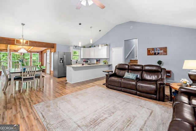 115 S Meadowcliff Cir, Carrollton, GA 30116 - living room with light wood finished floors, a ceiling fan, and vaulted ceiling