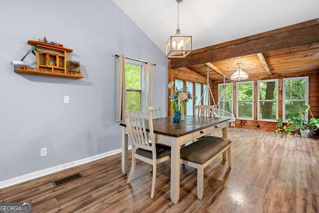 115 S Meadowcliff Cir, Carrollton, GA 30116 - dining space featuring a chandelier, wood finished floors, and baseboards