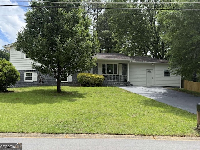 5460 Huron Dr, Morrow, GA 30260 - view of front facade with a porch, concrete driveway, and brick siding