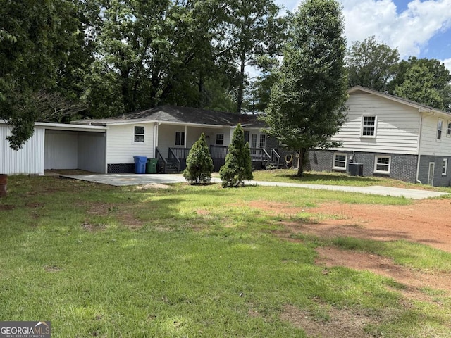 5460 Huron Dr, Morrow, GA 30260 - back of house featuring a lawn and a carport
