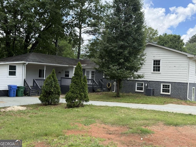5460 Huron Dr, Morrow, GA 30260 - view of front of home featuring a front yard, covered porch, and cooling unit