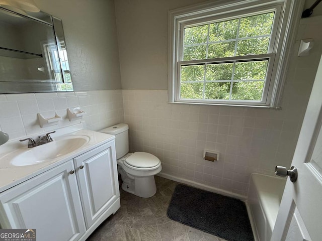 5460 Huron Dr, Morrow, GA 30260 - bathroom with tile walls, toilet, a shower, vanity, and a tub