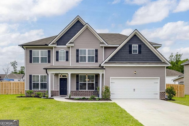 craftsman-style home with brick siding, driveway, covered porch, and a garage