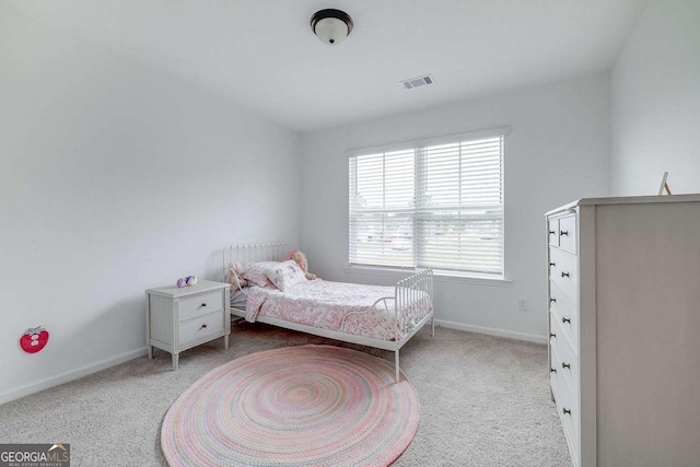carpeted bedroom featuring baseboards