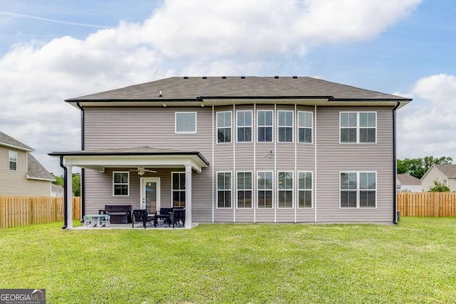 back of property featuring a ceiling fan, a patio, and an outdoor hangout area