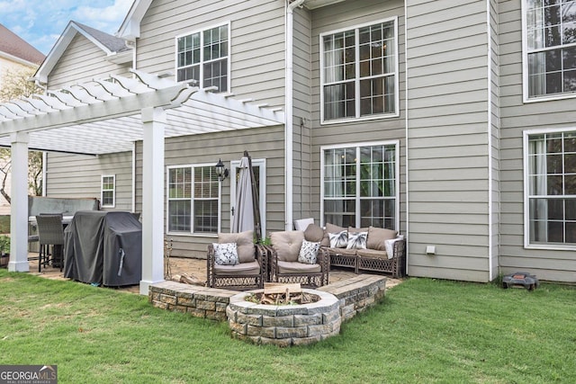 back of house with a pergola, an outdoor living space with a fire pit, a lawn, and a patio area