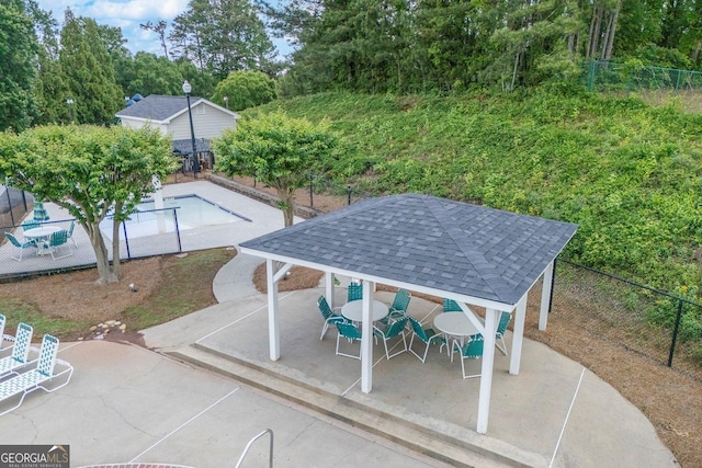 view of patio / terrace with a gazebo and fence