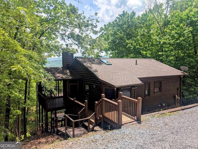 350 Left Turn Unit 15, Blue Ridge, GA 30513 - rear view of property featuring roof with shingles, a chimney, and a wooden deck