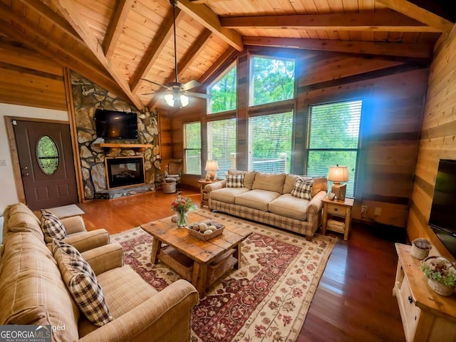 350 Left Turn Unit 15, Blue Ridge, GA 30513 - living area with wooden ceiling, wood walls, healthy amount of natural light, a stone fireplace, and wood finished floors