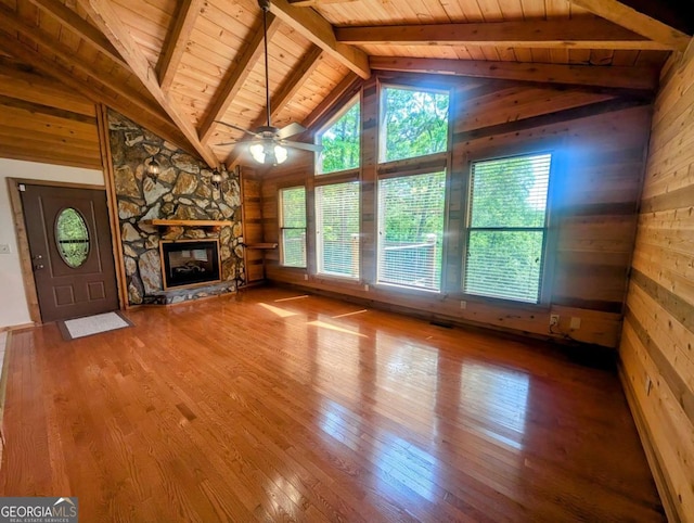 350 Left Turn Unit 15, Blue Ridge, GA 30513 - unfurnished living room featuring wood ceiling, plenty of natural light, hardwood / wood-style floors, wooden walls, and a fireplace