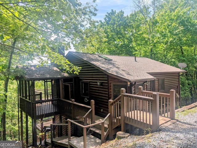 350 Left Turn Unit 15, Blue Ridge, GA 30513 - back of house featuring a shingled roof, a wooden deck, log veneer siding, and a chimney