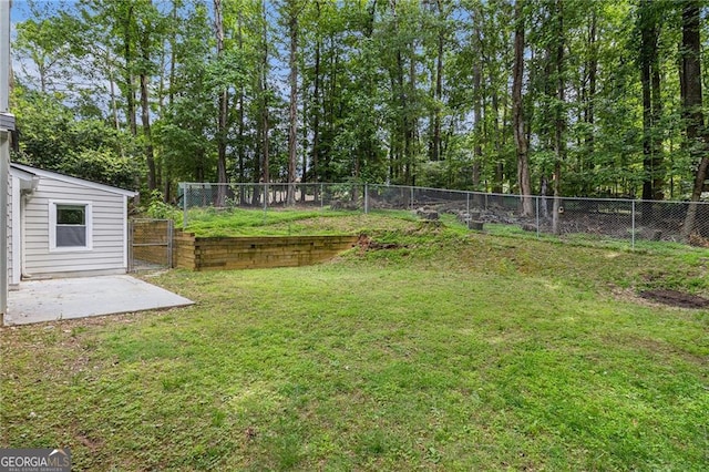 view of yard featuring a gate and a patio