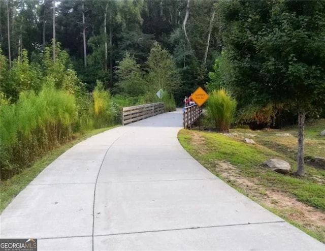 view of property's community with a forest view