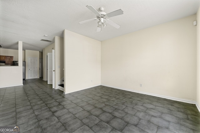 7331 Wagon Wheel Ct, Jonesboro, GA 30236 - spare room with ceiling fan, a textured ceiling, and baseboards