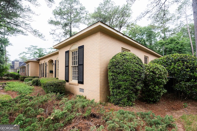 view of home's exterior featuring brick siding