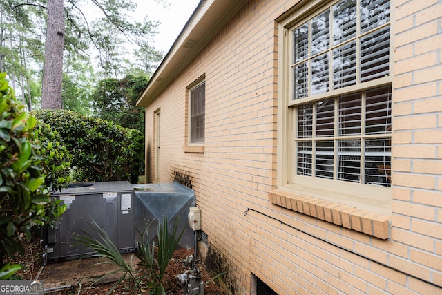 view of side of home featuring brick siding