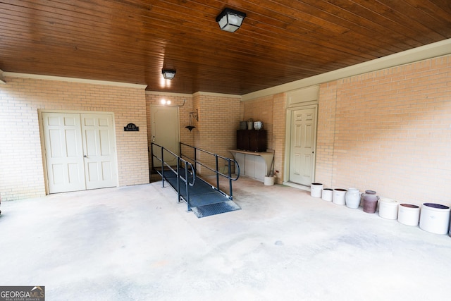 doorway to property featuring brick siding
