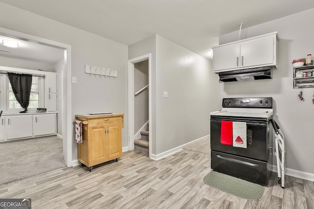 kitchen featuring electric stove, under cabinet range hood, light wood finished floors, baseboards, and white cabinets