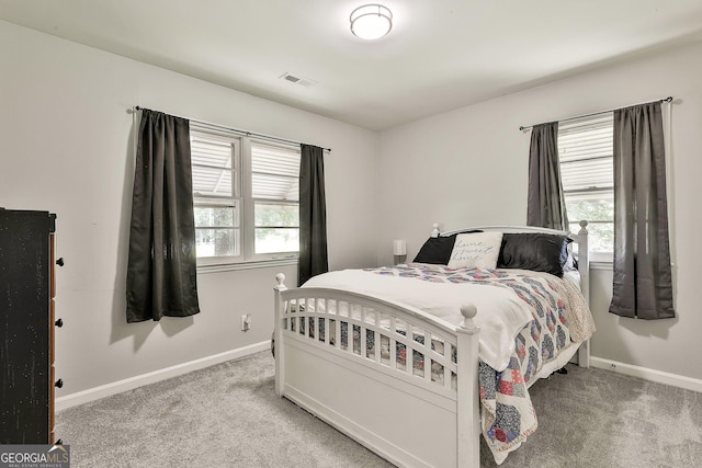 carpeted bedroom with baseboards
