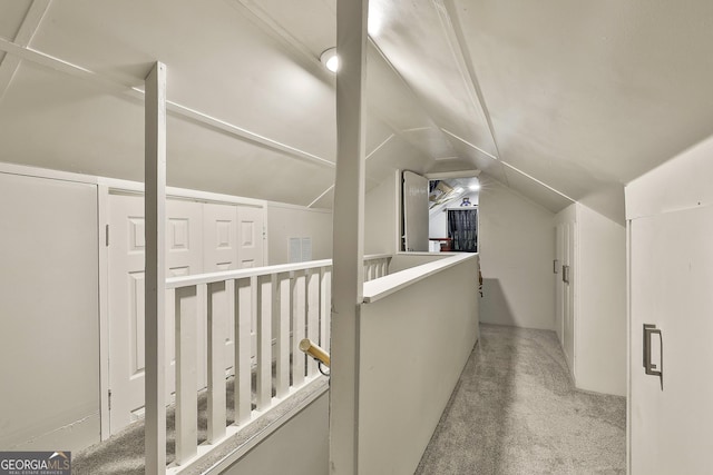 bonus room featuring vaulted ceiling and carpet floors