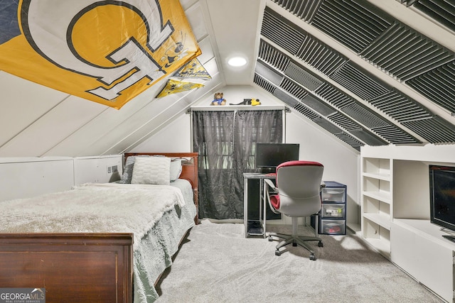 carpeted bedroom with vaulted ceiling