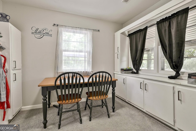 dining room with healthy amount of natural light and baseboards
