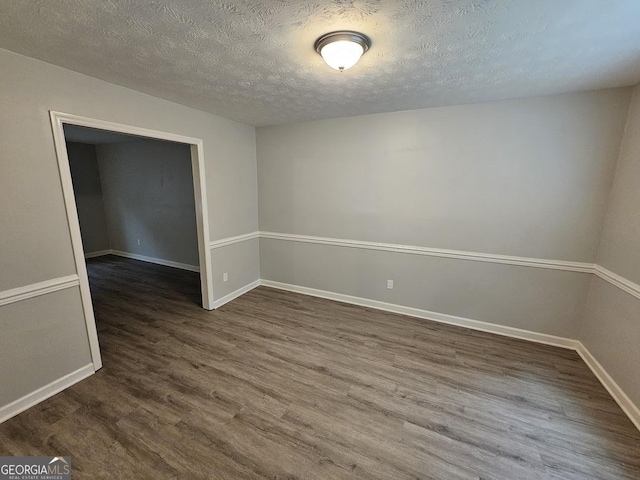 2860 Cocklebur Cove Ct, Decatur, GA 30034 - spare room with wood finished floors, a textured ceiling, and baseboards