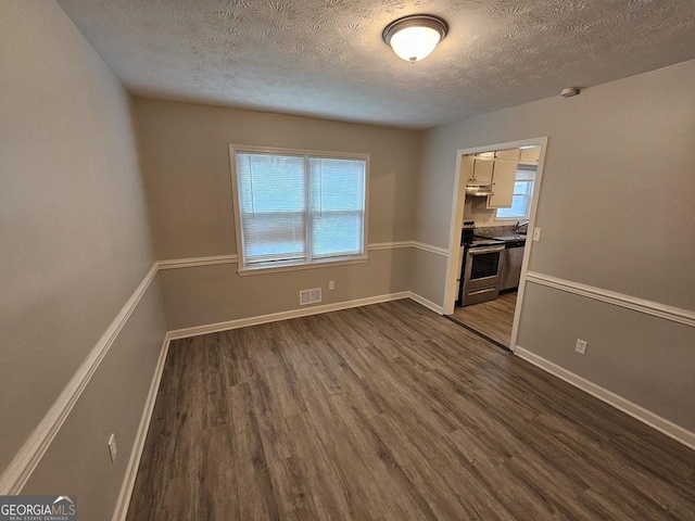 2860 Cocklebur Cove Ct, Decatur, GA 30034 - empty room featuring dark wood finished floors, a textured ceiling, baseboards, and a sink