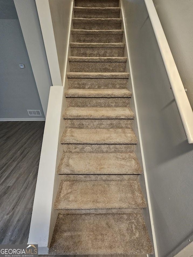 2860 Cocklebur Cove Ct, Decatur, GA 30034 - staircase with baseboards and wood finished floors
