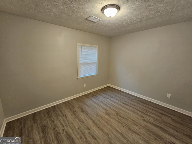 2860 Cocklebur Cove Ct, Decatur, GA 30034 - unfurnished room with dark wood-type flooring, baseboards, and a textured ceiling