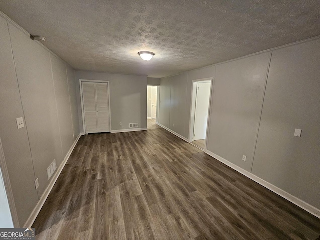 2860 Cocklebur Cove Ct, Decatur, GA 30034 - unfurnished room featuring dark wood finished floors, a textured ceiling, and baseboards