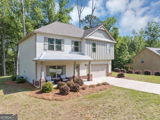 139 Coldwater Ln, Griffin, GA 30224 - view of front of home with a porch, a garage, concrete driveway, board and batten siding, and a front lawn